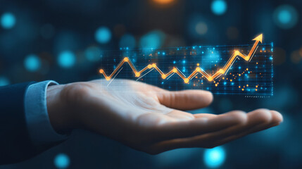 Businessman is holding a futuristic glowing graph hologram projection showing business growth