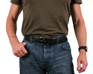 The handsome man wear blue jeans and black genuine leather belt.