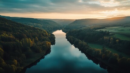 Fototapeta premium aerial view of sunset over the calm river