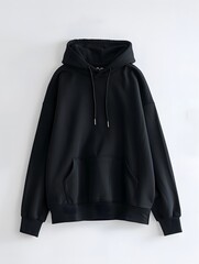 High-resolution photograph of a plain black hoodie with drawstring and pocket, isolated on a soft gradient background.