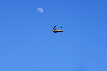 military transport helicopter flying on the blue sky with the moon, conflict, safety, defence, troops, transport helicopter, attack, observation