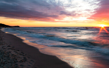 Fototapeta premium beautiful sunset over the Baltic Sea in the city, Pogorzelica, Poland.