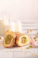 Delicious and sweet pistachio donuts with glaze and nuts.