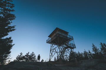 Male Hiker Blue Sky Sunset Silhouette Next to Acadia National Park Maine Beech Mountain Fire Tower. Hiking Trail Adventure Travel New England Autumn