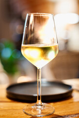 Glass of white sparkilng wine.