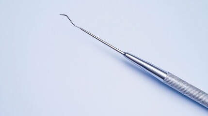 Naklejka premium Dental explorer tool on blue background