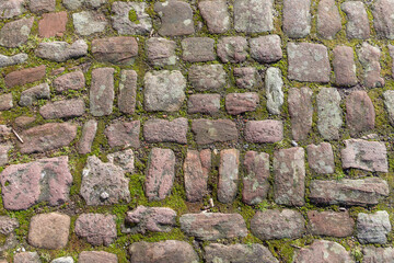 old paved cobblestones at a historic path, mostly sandstone, history background