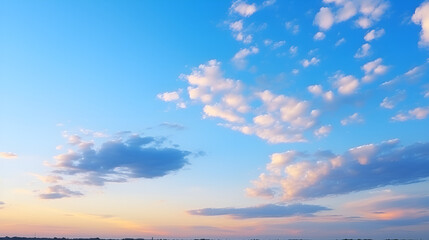 Obraz premium Beautiful sky at sunset featuring soft clouds and vibrant colors creating a serene atmosphere