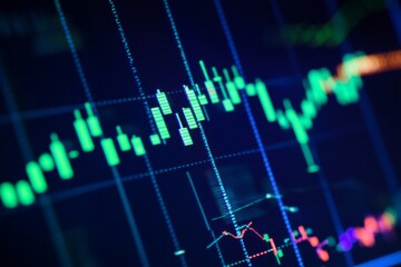 Fototapeta premium Close-up of a stock market graph on a dark blue screen, showing an upward trend with candlestick charts and green bar candles. Ideal for finance and investment themes.