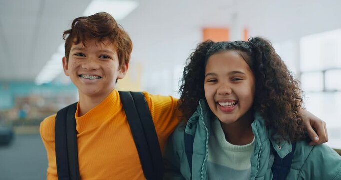 Friends, portrait and children in school, hug and bonding in classroom with backpack, happy and young. Education, embrace and boy with girl in hallway, student and together in academy with bag or joy