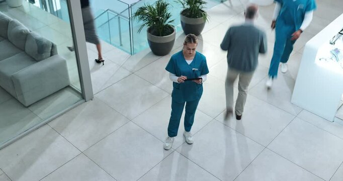 Tablet, nurse or woman in busy clinic with chart, results or healthcare schedule for hospital management. Thinking, planning and medical professional in lobby with folder, checklist and digital app