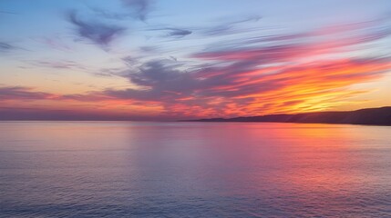 Fototapeta premium Serene Sunset Over the Ocean, A Vibrant Display of Colors and Calm Waters.
