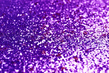Shiny violet blue glitter, closeup. Halloween background