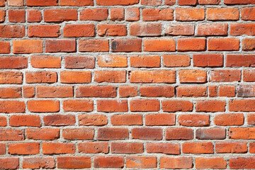 Red brick wall background with visible textures and patterns, perfect for creative projects or adding a nostalgic and timeless touch to any space.