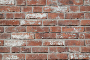 Fototapeta premium Red brick wall background with visible textures and patterns, perfect for creative projects or adding a nostalgic and timeless touch to any space.