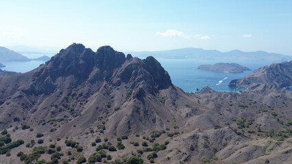 Fototapeta premium Komodo National Park, Padar Island with the famous pink beach. Aerial view of the mountainous landscape near the coast, drone view