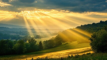 Glowing golden sky with rays of sunlight breaking through clouds at dawn, illuminating a serene countryside