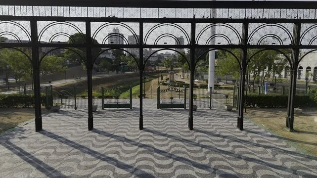 Drone flies through gates at southern entrance to Parque Senador Jefferson Peres in Manaus, Amazonas, Brazil