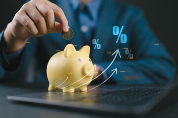 Businessman hand on piggy bank with growth up arrow, saving money wealth and financial concept,...