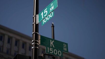 Fototapeta premium K street nw and 15th street nw street signs in downtown Washington DC symbolizing lobbying and corruption in nations capital