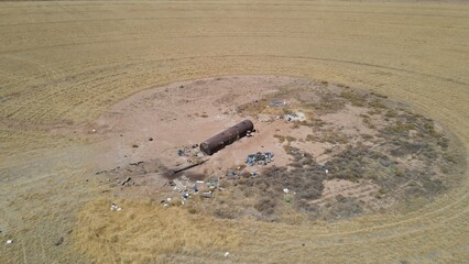Farm, big sprinklers, green fields, crops, irrigation, water, sunlight, soil, growth, nature, breeze, horizon, open sky, rain, arcs of water, life, earth, landscape, serenity, rows of crops, harvest, 