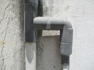 PVC pipe in a grunge cement wall 