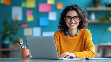 Happy Woman Working on Laptop in Home Office with Colorful Post it Notes