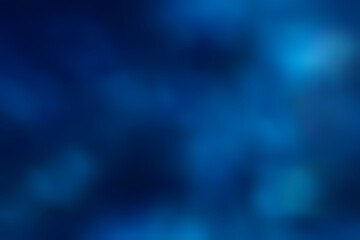 暗い紺碧の背景にフワフワ明るい水泡がおぼろげに浮かぶ静かな抽象的テクスチャー © SAIGLOBALNT