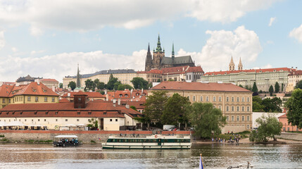 Obraz premium View from opposite bank of Vltava to St Vitus Cathedral and Nova Strana district of Prague in Czech Republic