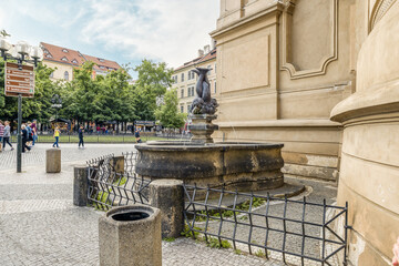 The Fountain with Three Entangled Dolphin Bodies on Old Town Square in old part of Prague in Czech Republic