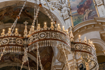 A large crystal chandelier hangs from the ceiling in St Nicholas Church in the Prague in Czech...