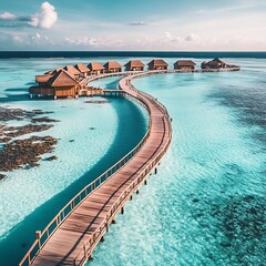 Wooden pier leading to tropical island with water bungalows