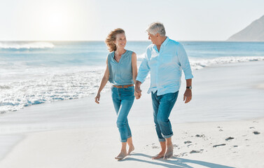 Love, holding hands and walking with old couple at beach for travel destination, summer and...