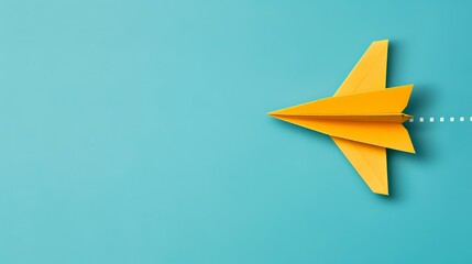 Yellow paper airplane flying on a blue background, representing innovation and creativity.