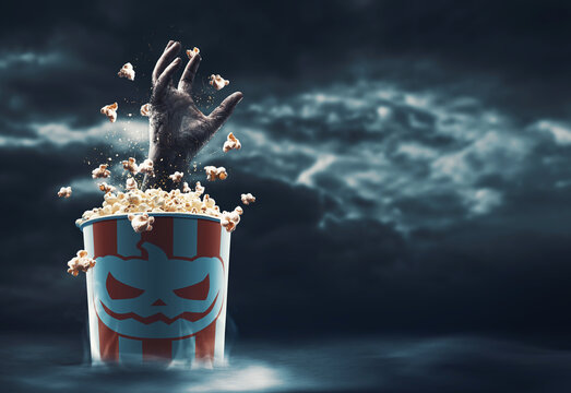 Zombie hand coming out of a popcorn bucket