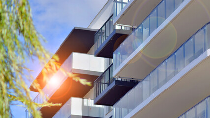 Fototapeta premium Modern architecture of urban residential apartment buildings on a sunny day. Facade of a modern apartment building.