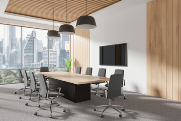 Modern conference room with a large board table, chairs, and a screen on the wall. Wooden paneling and large windows with a cityscape background. Business concept. 3D Rendering