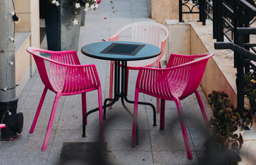 TABLE AND CHAIRS IN FRONT OF THE CAFE 