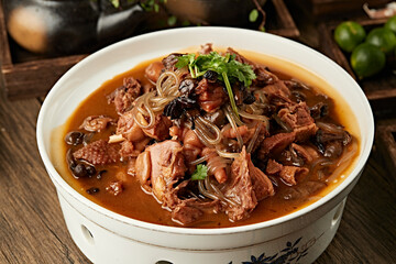 Traditional Northeastern home-cooked dish: Chicken stewed with mushrooms (chicken stewed with hazel...