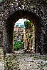 Medieval stone arches giving access to the old town of Tui, Pontevedra.