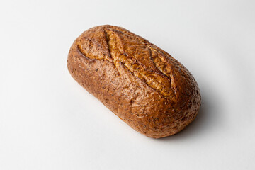 whole grain bread on white background homemade fresh baked