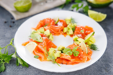 Smoked salmon salad with avocado and herbs. Perfect for healthy, light, and nutritious meals