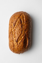 whole grain bread on white background homemade fresh baked