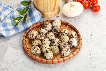 Raw quail eggs in the bowl
