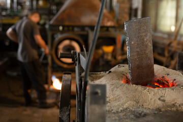 Ferrous metal billet is melted in an induction furnace closeup