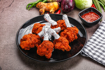 Indian cuisine glazed chicken lollipop