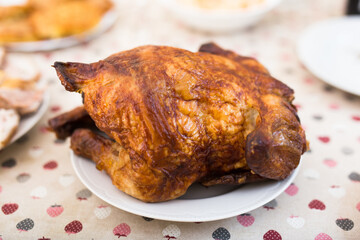 Whole roasted chicken on a plate