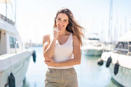 Young pretty woman at outdoors . Portrait