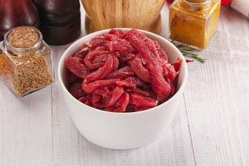 Raw beef meat - sliced strips