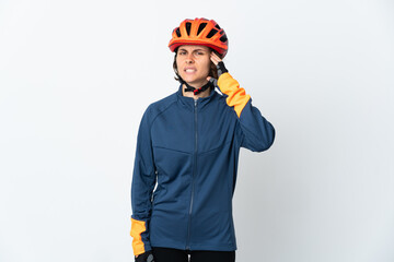 Young English cyclist woman isolated on white background having doubts